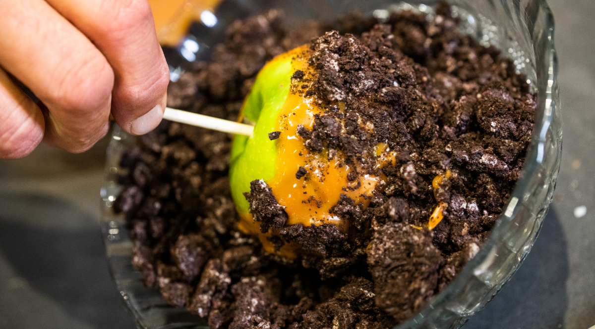 Caramel Apple dipped in crushed oreos