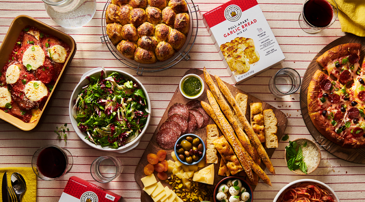 Assortment of deliciously cooked foods along with King Arthur Garlic Bread Mix