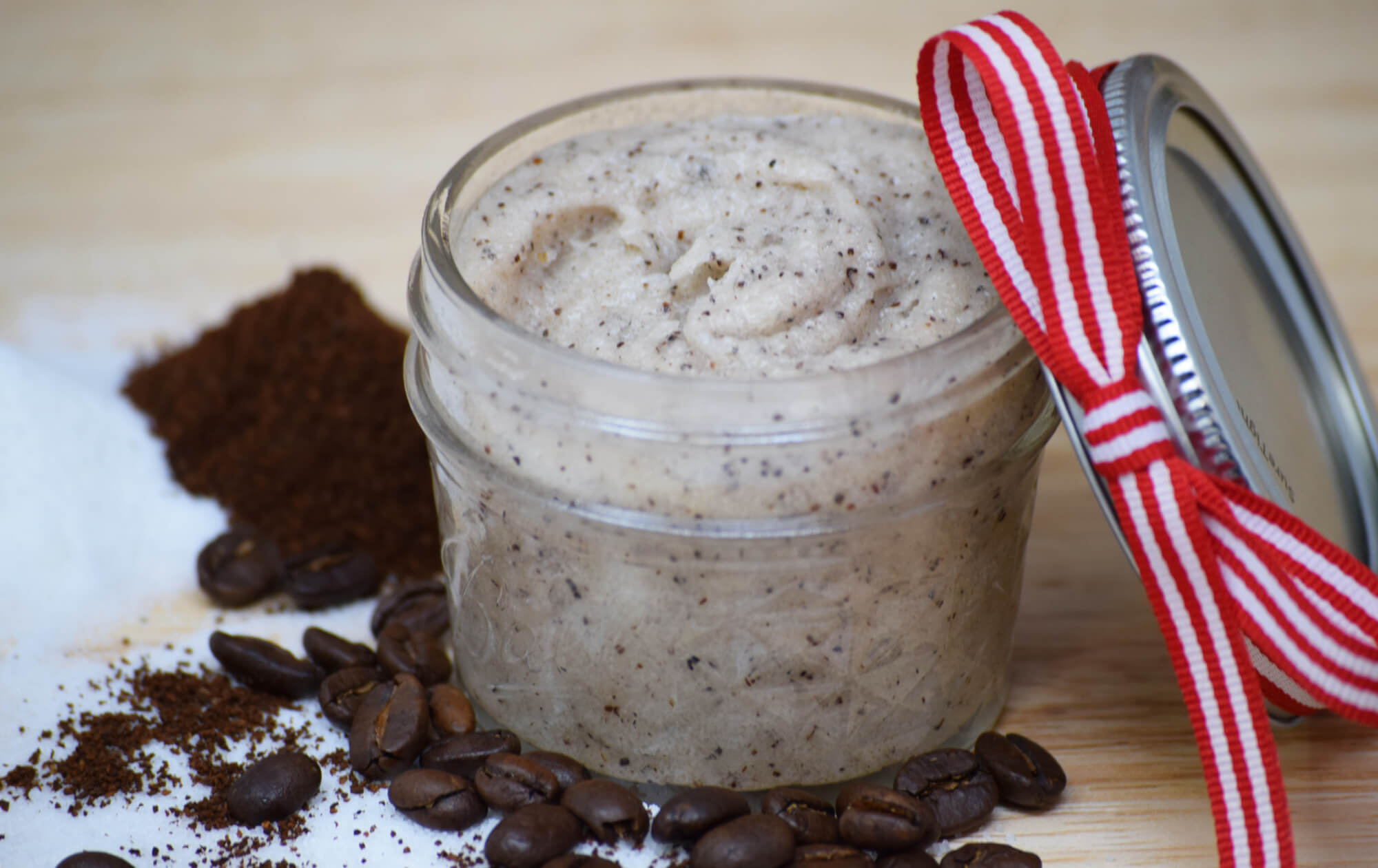 A small glass jar with homemade all-natural lip scrub