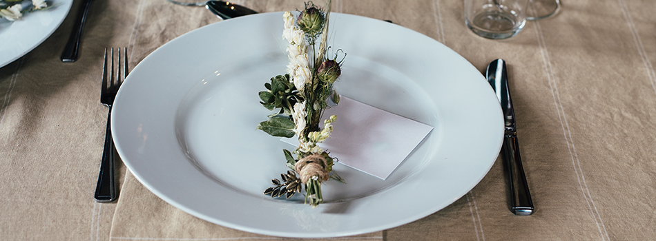 An empty place setting at a dining table